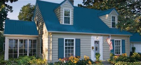 beige house with blue metal roofing|beige and blue exterior homes.